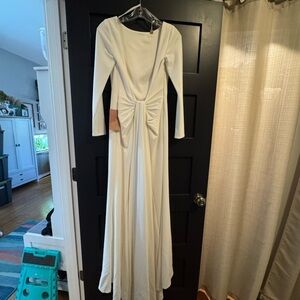 Long sleeve, low back with train new with tags wedding gown!
